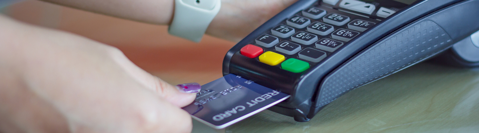 Person making a purchase with a debit card